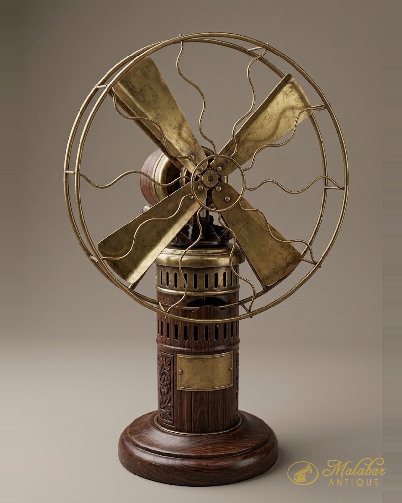 Early electric table fan with brass blades and cage on a turned wooden base.