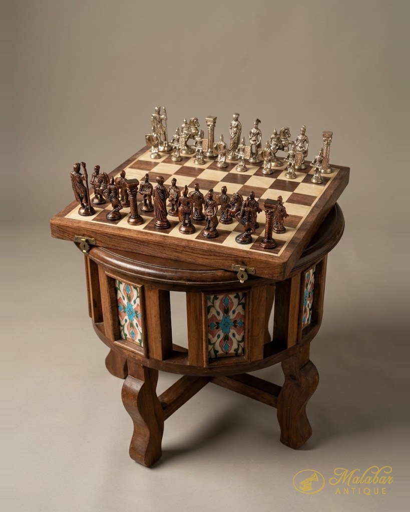 Octagonal teak games table with inset painted tiles, topped by an inlaid chessboard and a full set of cast metal figural chessmen.